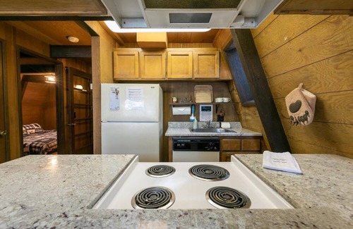 Truckee Cabin | Classic Tahoe a-frame cabin forest view floor2ceiling window. Near Northstarn