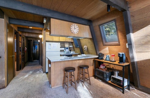 Truckee Cabin | Classic Tahoe a-frame cabin forest view floor2ceiling window. Near Northstarn
