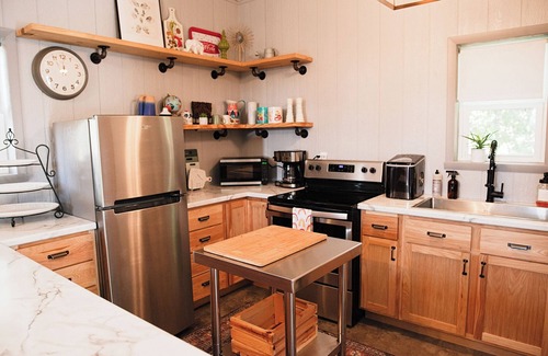 Kerr House | Clean and cozy barn home nestled in the trees with peaceful outdoor spaces!