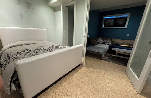 East Village House | close to stampede, private room and bathroom in the basement, a small living