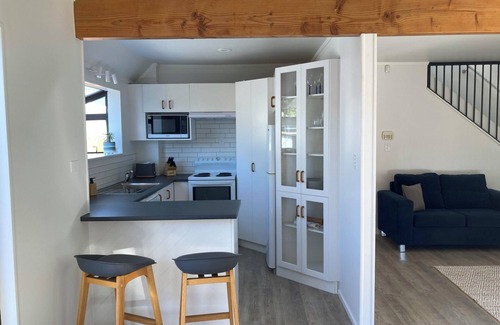 Papamoa Beach Cottage | Coastal retreat with spa pool — newly renovated and a short walk to the beach