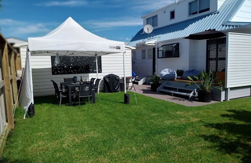 Papamoa Beach Cottage | Coastal retreat with spa pool — newly renovated and a short walk to the beach
