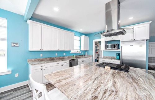 Grand Isle House | Coastal View: A charming 3-bedroom camp in Grand Isle, LA, across from the beach.