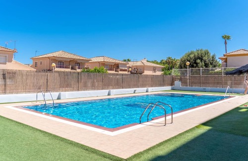 Santiago de la Ribera Apartment | Comfortable apartment with shared pool near the beach.