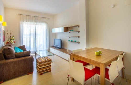 Santiago de la Ribera Apartment | Comfortable apartment with shared pool near the beach.