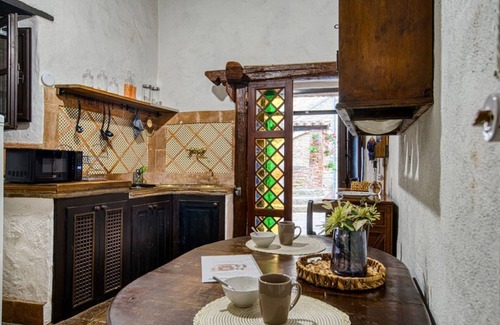 Magione Apartment | Comfortable apartment located in a historic Abbey from the year 1000, restored in 1980.La Badia is a small Benedictine Abbey immersed in a park of centuries-old olive trees.Located on the ground floor, there is a mezzanine for the sleeping area.There are