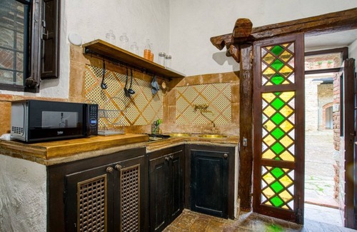 Magione Apartment | Comfortable apartment located in a historic Abbey from the year 1000, restored in 1980.La Badia is a small Benedictine Abbey immersed in a park of centuries-old olive trees.Located on the ground floor, there is a mezzanine for the sleeping area.There are
