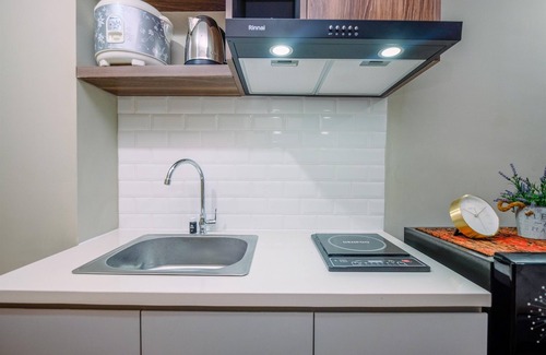 Duren Sawit Apartment | Comfortable Pool View Studio Room at LRT City Jatibening Apartment