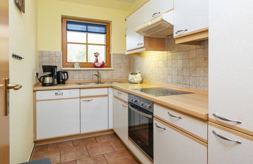 Zingst Apartment | Comfortable vacation apartment with balcony, indoor pool and garden view in Zingst