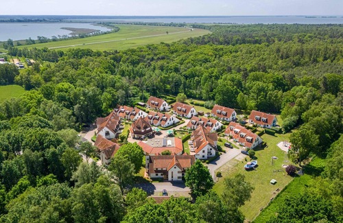 Zingst Apartment | Comfortable vacation apartment with balcony, indoor pool and garden view in Zingst