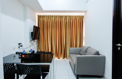 Pagedangan Apartment | Comfy 1BR Casa De Parco Apartment By Travelio