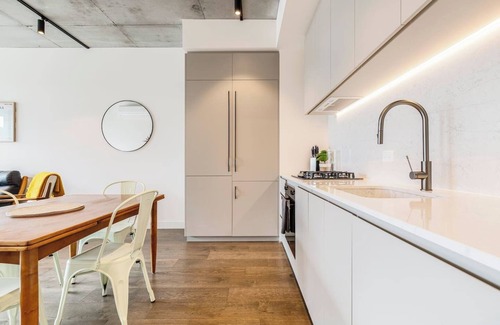 Brunswick Apartment | Concrete Junction Sunny Industrial Balcony Haven