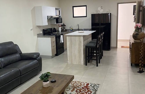 San Salvador Condo | Condo In El Salvador, with a King-size bed.