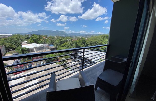 San Salvador Condo | Condo In El Salvador, with a King-size bed.