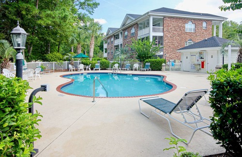 Myrtle Beach House | Condo with central AC, washer/dryer, shared outdoor pool, & on-site golf