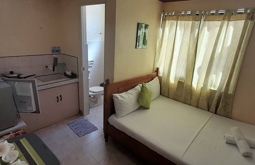 Balabag Apartment | Coralyn's Place small room with private toilet and kitchenette