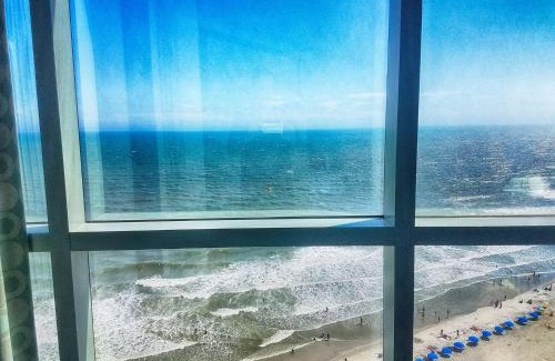 Downtown Myrtle Beach Apartment | Corner condo w 180 ocean views & pools