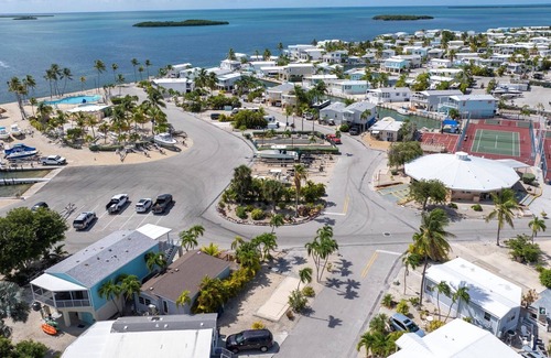 Cudjoe Key RV Rental | Corner RV Lot with Lagoon Views, Palm Trees, and Steps to Pool & Amenities