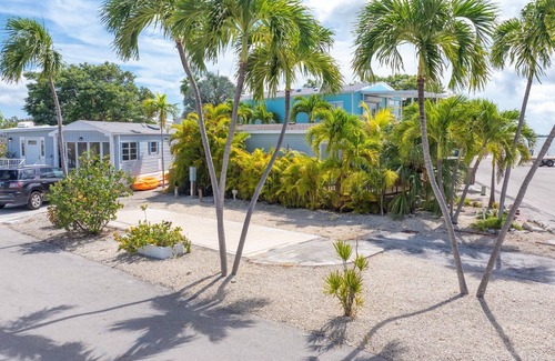 Cudjoe Key RV Rental | Corner RV Lot with Lagoon Views, Palm Trees, and Steps to Pool & Amenities