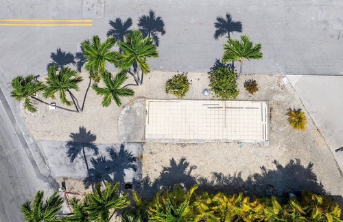 Cudjoe Key RV Rental | Corner RV Lot with Lagoon Views, Palm Trees, and Steps to Pool & Amenities
