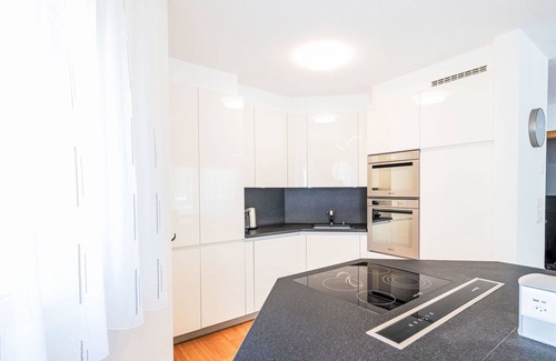 Leukerbad Apartment | Cosy apartment for 8 guests with WIFI, hot tub, TV, balcony and panoramic view