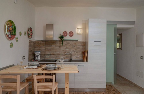 Eden Beach Villa | Cosy apartment in villa for 3 guests with A/C, pool, WIFI, TV and patio