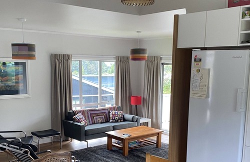 Surfdale Cottage | Cottage in Surfdale with beautiful bush views and a peak of the sea.