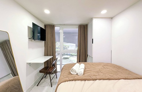 Tan Qui Dong Apartment | Cozy budget room in D7 with chill rooftop