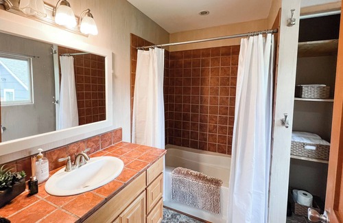 Five Corners House | Cozy cabin in town w/ sunroom, huge playset/backyard, dog yard, fire pit, BBQ