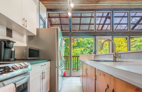 Wymbolwood Beach Cottage | Cozy Cottage Across from Blue Waters with Hot Tub!