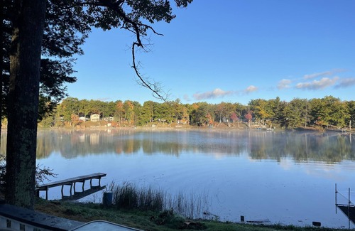 Curtis Township Cottage | Cozy cottage in Glennie MI on all sports North Lake with deck, dock & firepit.