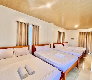 Catangnan House | Cozy Family Studio - Ronaldos Inn Twinex Suite