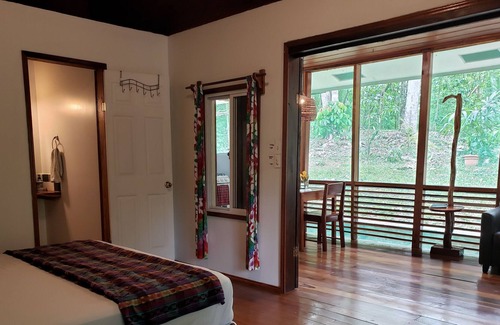 San Ignacio Cabin | Cozy Forest Screened Cabin- 2 beds, AC, firepit patio -7 min to downtown