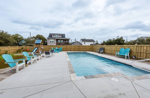 Kill Devil Hills Apartment | Cozy King Suite, POOL/GRILL/outdoor shower, coffee bar, mini fridge, microwave