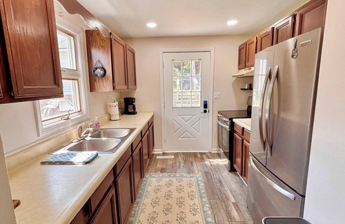 Rapid City House | Cozy Main Level Torch Lake Stay with Private Entry & Fire Pit