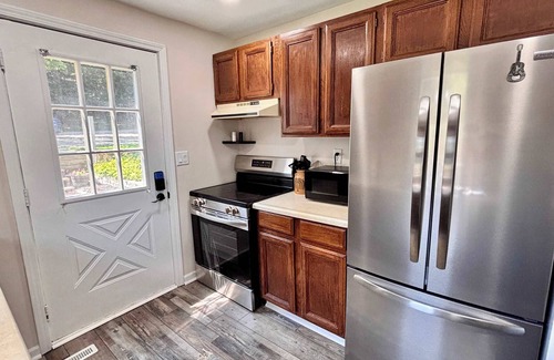 Rapid City House | Cozy Main Level Torch Lake Stay with Private Entry & Fire Pit