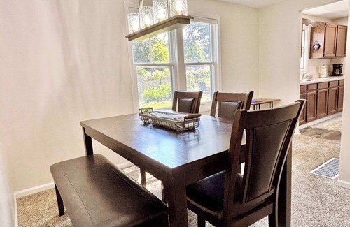 Rapid City House | Cozy Main Level Torch Lake Stay with Private Entry & Fire Pit