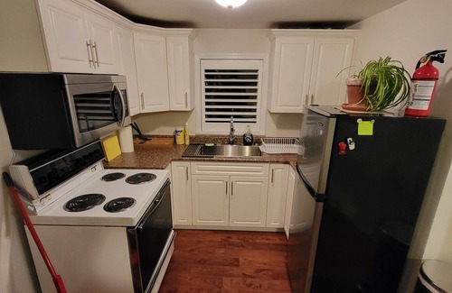 Kensington-Cedar Cottage House | Cozy two bed home located minutes from down town.