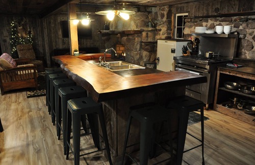 Cleveland Cabin | Cozy up in this rustic Stone Lodge and relax by the fireplace