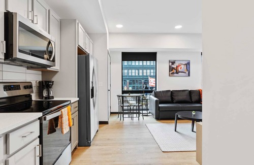 Lockerbie Square Apartment | CozySuites Mass with parking, lounge and roof deck 12