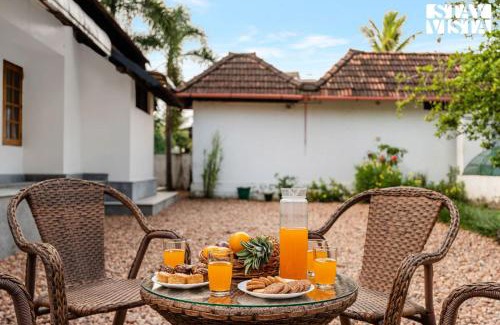 Tiruvalla Villa | CVM House with Lawn at Thiruvalla by StayVista