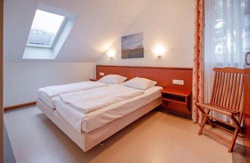 Binz Apartment | Dünenpark Binz - Komfort Ferienwohnung mit 2 Schlafzimmern und Balkon im Dachgeschoss 031