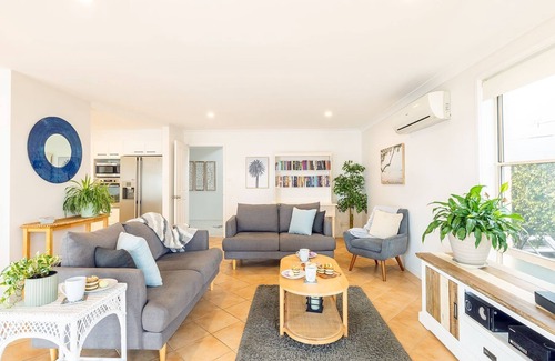 Corlette House | Danalene, 44a Danalene Pde - stunning waterfront property with Air Con, WI-FI, Garage & Boat Parking