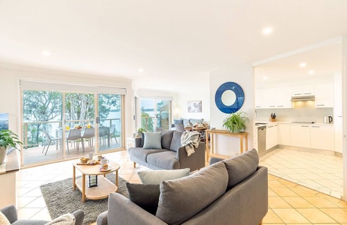 Corlette House | Danalene, 44a Danalene Pde - stunning waterfront property with Air Con, WI-FI, Garage & Boat Parking