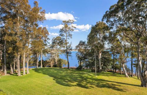 Corlette House | Danalene, 44a Danalene Pde - stunning waterfront property with Air Con, WI-FI, Double Lock Up Garage & Boat Parking