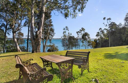 Corlette House | Danalene, 44a Danalene Pde - stunning waterfront property with Air Con, WI-FI, Double Lock Up Garage & Boat Parking