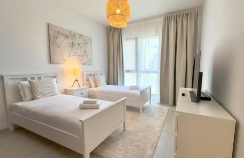 Umm Suqeim 3 Apartment | Dar Vacation - Bright & Stylish 2 BR with Pool View, Near Burj AlArab