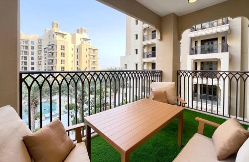 Umm Suqeim 3 Apartment | Dar Vacation - Bright & Stylish 2 BR with Pool View, Near Burj AlArab
