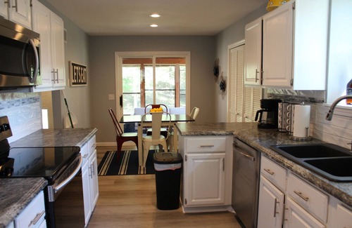 Osage Beach House | Deck & patio overlook the private boat dock, fire pit, & tons of land to explore