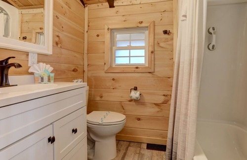 Walnut Mountain Cabin | Deja View - Take in tranquil wooded views and soak in the hot tub!